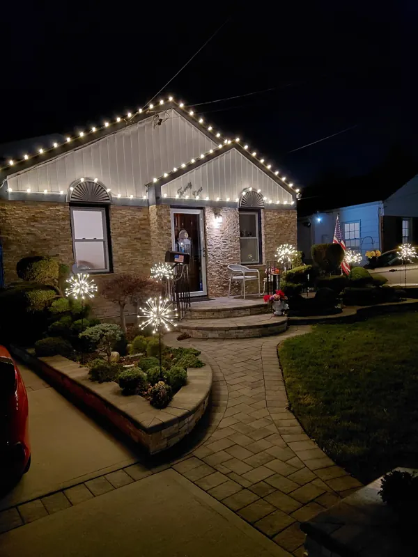 Christmas light installation on Long Island by North Star: warm white roofline and gable outline