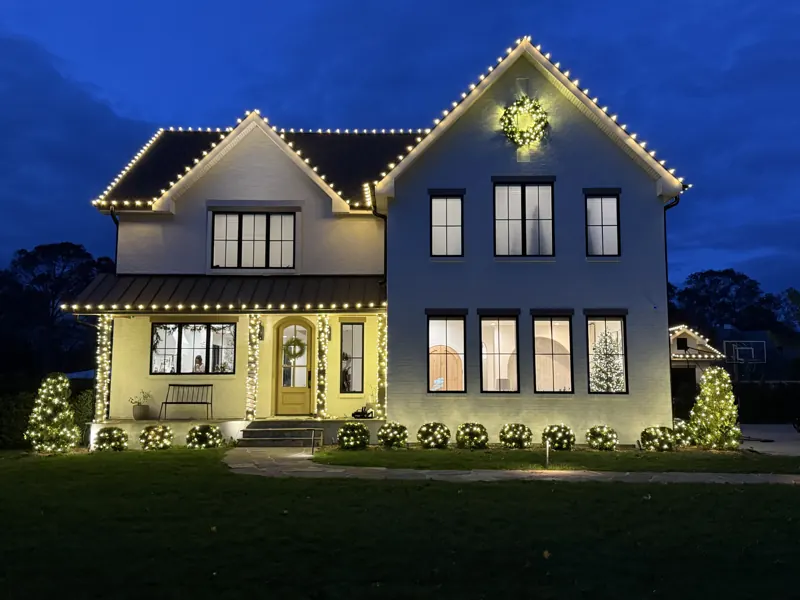 Christmas light installation on Long Island by North Star: warm white C9 roofline on a two-story colonial
