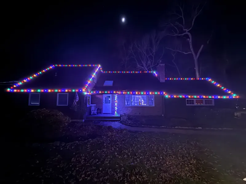 Christmas light installation on Long Island by North Star: multicolor roofline on a ranch home
