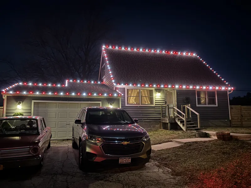 Christmas light installation on Long Island by North Star: multicolor roofline on a split-level home