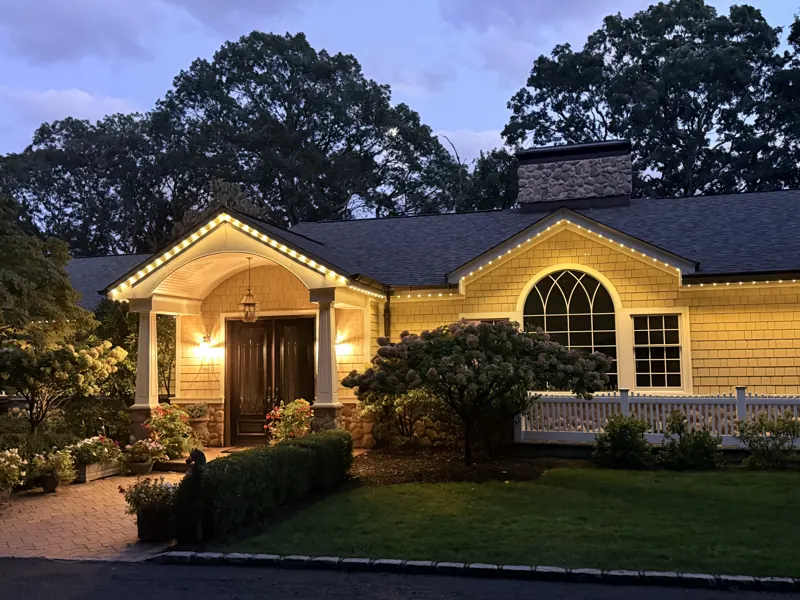 Permanent outdoor lighting on Long Island by North Star: permanent lighting framing the front entry