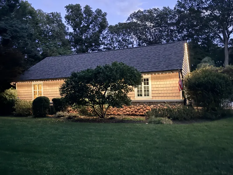Permanent outdoor lighting on Long Island by North Star: warm white permanent roofline at dusk