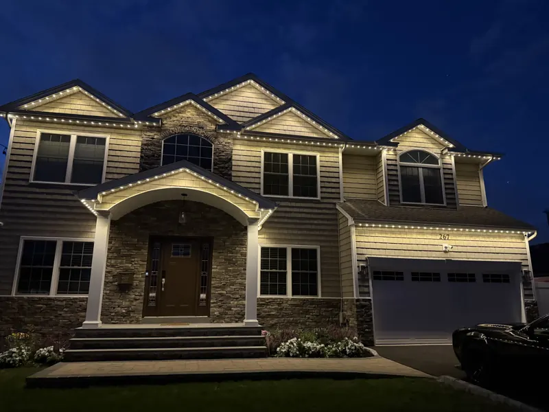 Permanent outdoor lighting on Long Island by North Star: permanent roofline lighting on a two-story colonial