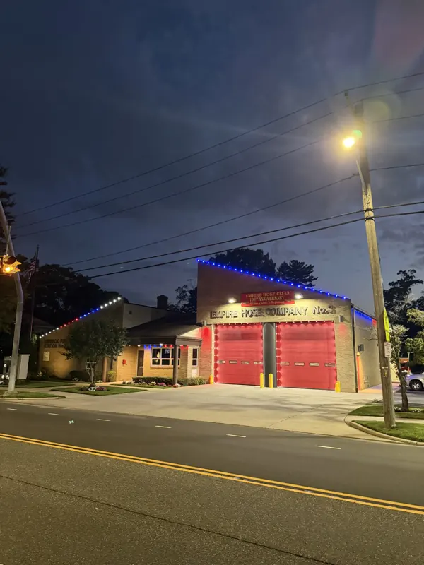 Permanent outdoor lighting on Long Island by North Star: firehouse permanent lighting seen from the street