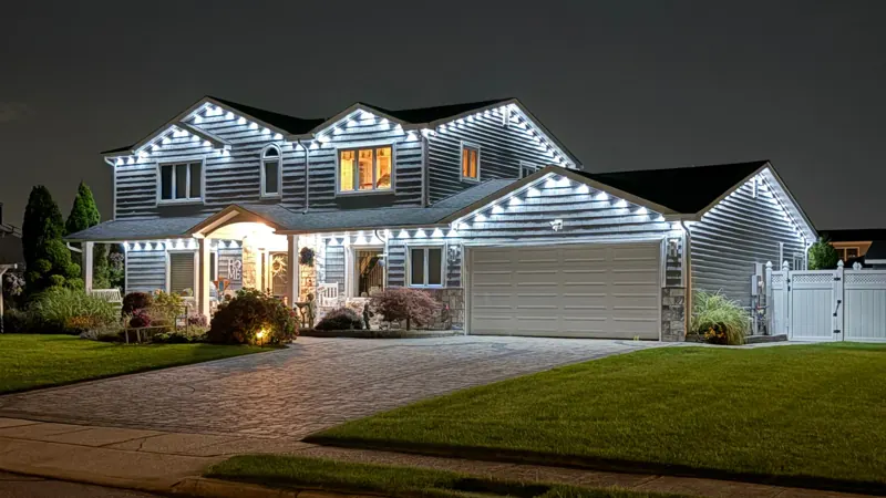 Permanent outdoor lighting on Long Island by North Star: cool white permanent lighting on a two-story home