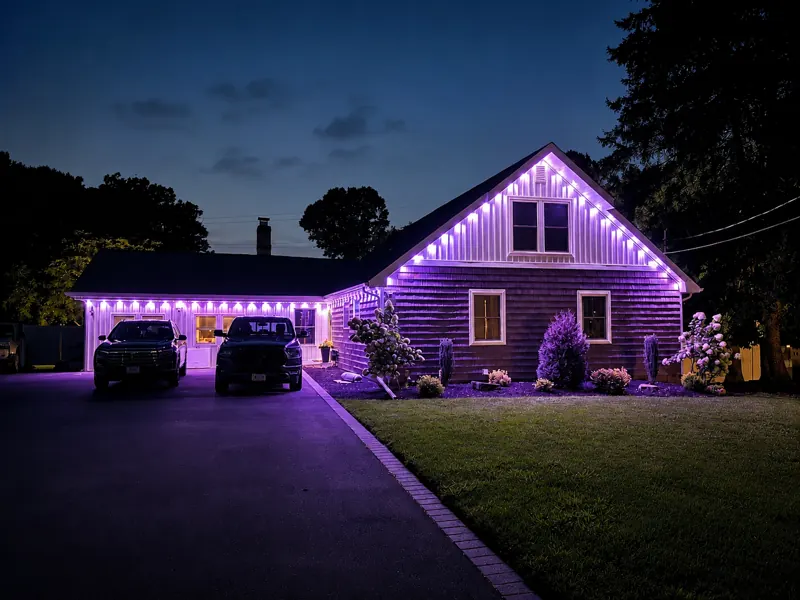 Permanent outdoor lighting on Long Island by North Star: same home, switched to purple from the app