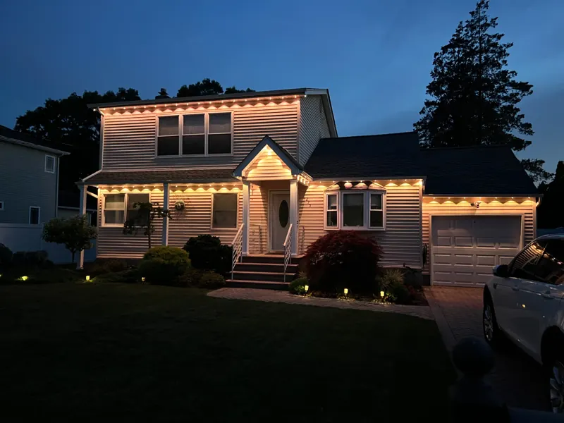 Permanent outdoor lighting on Long Island by North Star: warm white permanent roofline and entry
