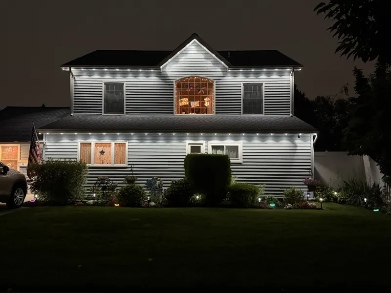 Permanent outdoor lighting on Long Island by North Star: cool white permanent lighting on both rooflines