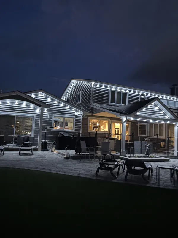 Permanent outdoor lighting on Long Island by North Star: permanent lighting over a backyard patio