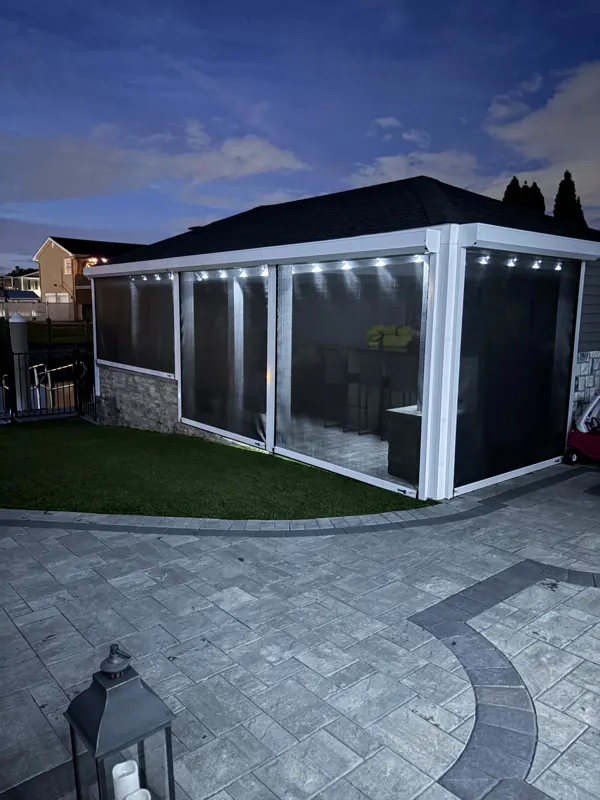 Permanent outdoor lighting on Long Island by North Star: permanent lighting around a screened pavilion